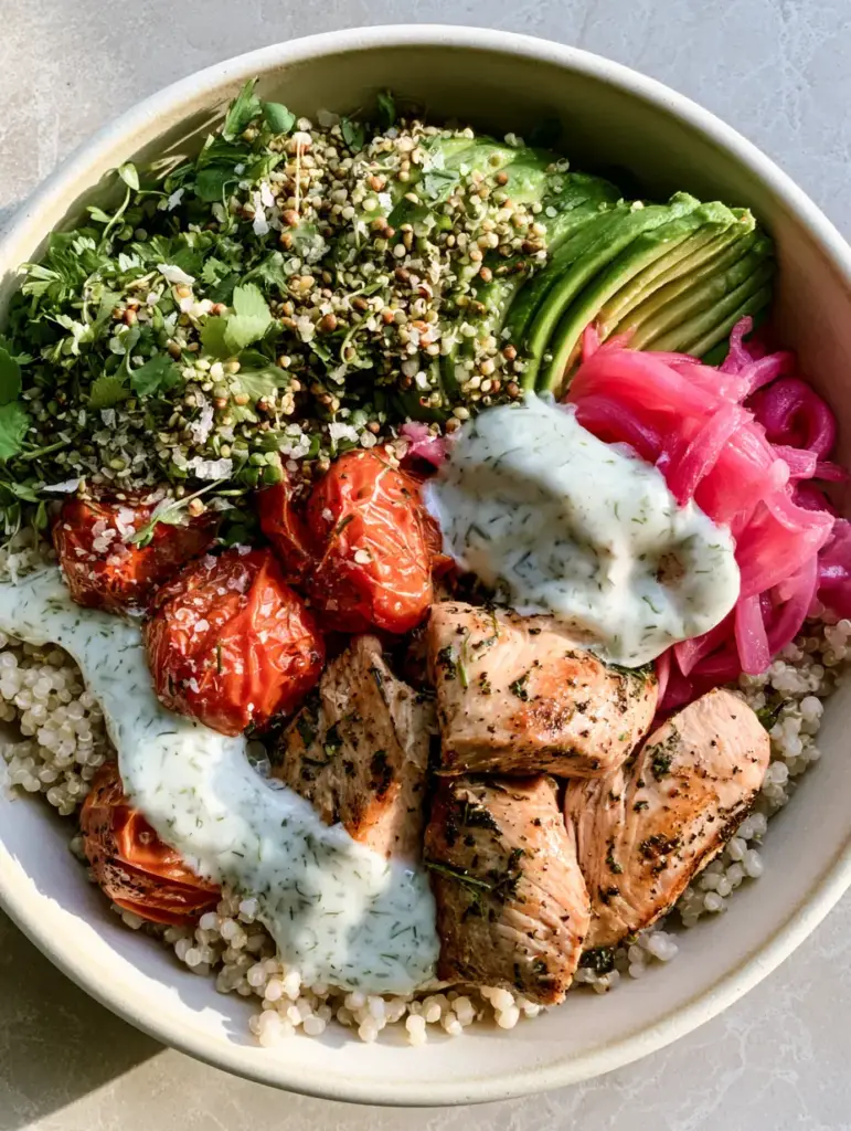 Healthy Bowl Recipes: The Ultimate Lemon-Herb Chicken and Quinoa Power Bowl 1 Close up of seared chicken breast and blistered cherry tomatoes in a ceramic bowl. (Healthy bowl recipes)